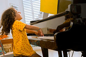 little girl playing piano